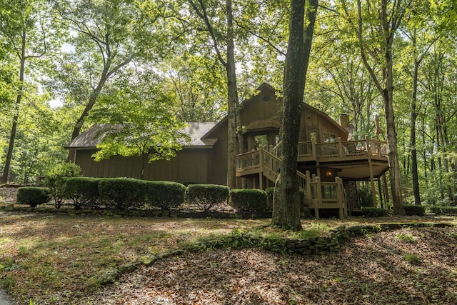 636 Crader Ct, Springfield, MO 65802 - rear view of property featuring a wooden deck and a chimney