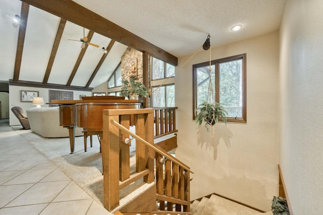 636 Crader Ct, Springfield, MO 65802 - staircase with tile patterned flooring, beamed ceiling, a textured ceiling, a ceiling fan, and high vaulted ceiling