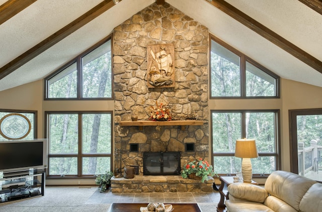 636 Crader Ct, Springfield, MO 65802 - living room featuring high vaulted ceiling, beam ceiling, healthy amount of natural light, and a stone fireplace