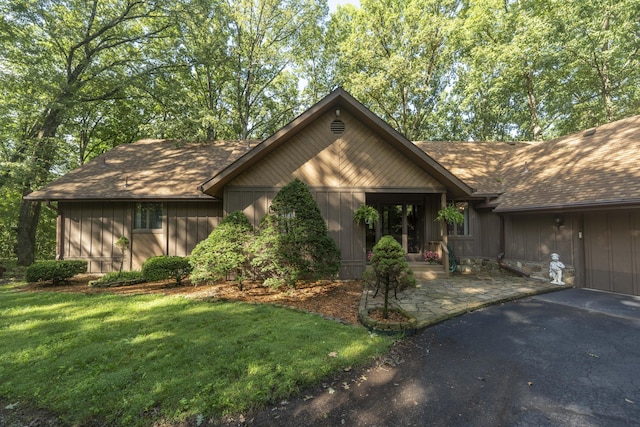 636 Crader Ct, Springfield, MO 65802 - view of front of property featuring a shingled roof, a front lawn, and asphalt driveway
