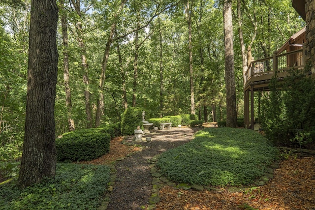 636 Crader Ct, Springfield, MO 65802 - view of yard featuring a deck and a wooded view