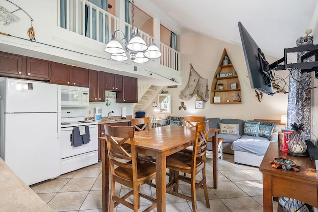440 Fall Creek Dr Unit 7, Branson, MO 65616 - dining area featuring a chandelier, light tile patterned floors, and high vaulted ceiling
