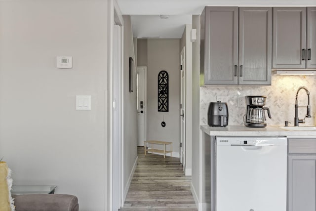 530 Abby Ln Unit 5, Branson, MO 65616 - kitchen with dishwasher, gray cabinetry, decorative backsplash, and light wood-style flooring