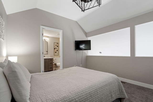 530 Abby Ln Unit 5, Branson, MO 65616 - carpeted bedroom featuring lofted ceiling, connected bathroom, and a chandelier