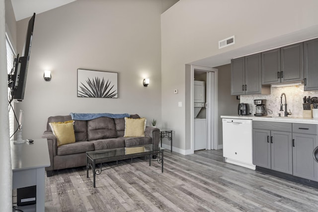 530 Abby Ln Unit 5, Branson, MO 65616 - living area with high vaulted ceiling and light wood-style flooring