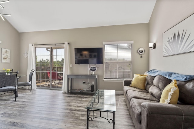 530 Abby Ln Unit 5, Branson, MO 65616 - living room featuring wood finished floors, plenty of natural light, and vaulted ceiling