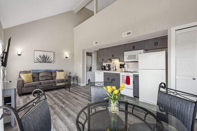 530 Abby Ln Unit 5, Branson, MO 65616 - living room featuring high vaulted ceiling, light wood finished floors, and beamed ceiling