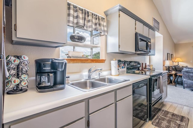 27 Blue Bird Way Unit 5, Branson, MO 65616 - kitchen featuring black appliances, light countertops, and light wood-type flooring
