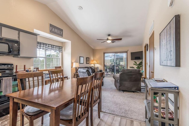 27 Blue Bird Way Unit 5, Branson, MO 65616 - dining area with vaulted ceiling, light wood-style flooring, ceiling fan, and plenty of natural light