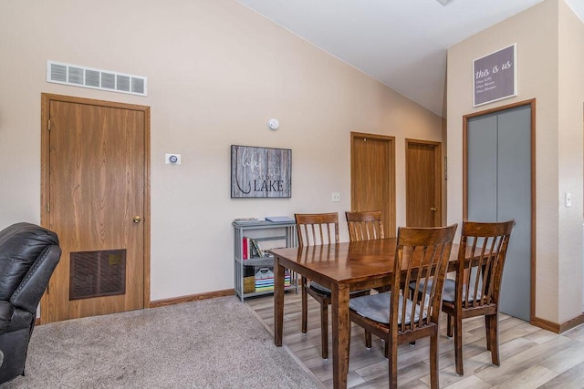 27 Blue Bird Way Unit 5, Branson, MO 65616 - dining room featuring high vaulted ceiling and light wood-style flooring