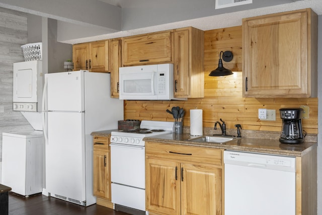 1 Memory Ln Unit 5, Branson, MO 65616 - kitchen featuring white appliances, stacked washer / dryer, wood walls, and dark wood-style floors