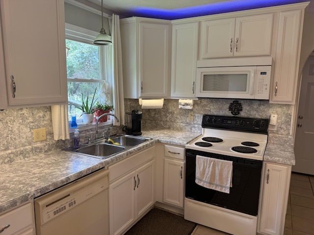 2304 E Huntington St, Ozark, MO 65721 - kitchen with white appliances, decorative backsplash, white cabinetry, decorative light fixtures, and light countertops