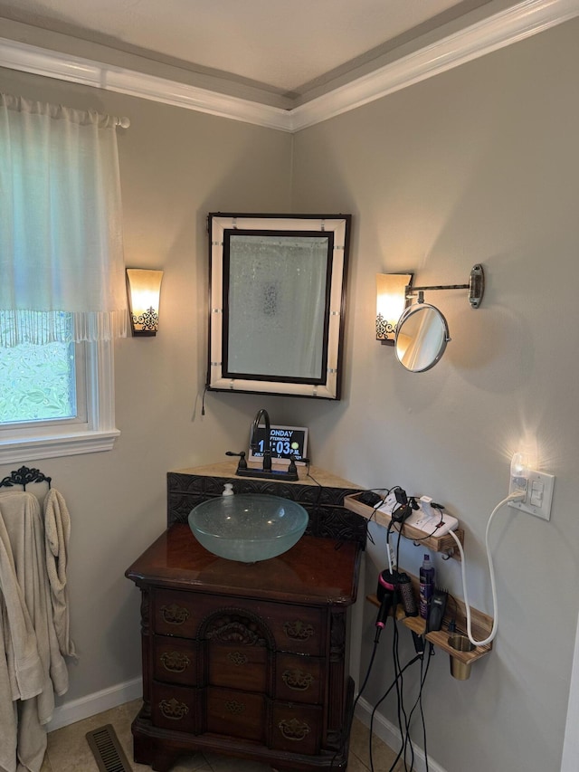 2304 E Huntington St, Ozark, MO 65721 - bathroom featuring vanity, ornamental molding, and tile patterned flooring