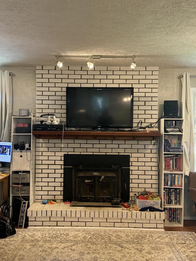 2304 E Huntington St, Ozark, MO 65721 - detailed view of a fireplace and a textured ceiling
