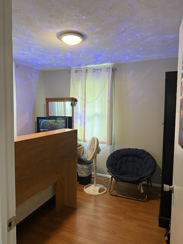 2304 E Huntington St, Ozark, MO 65721 - bedroom featuring a textured ceiling and wood finished floors