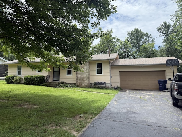 2304 E Huntington St, Ozark, MO 65721 - ranch-style home featuring driveway, an attached garage, and a front lawn
