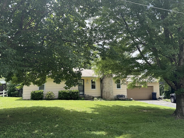 2304 E Huntington St, Ozark, MO 65721 - obstructed view of property with a front yard and an attached garage