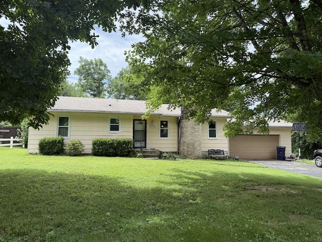 2304 E Huntington St, Ozark, MO 65721 - ranch-style home featuring an attached garage and asphalt driveway