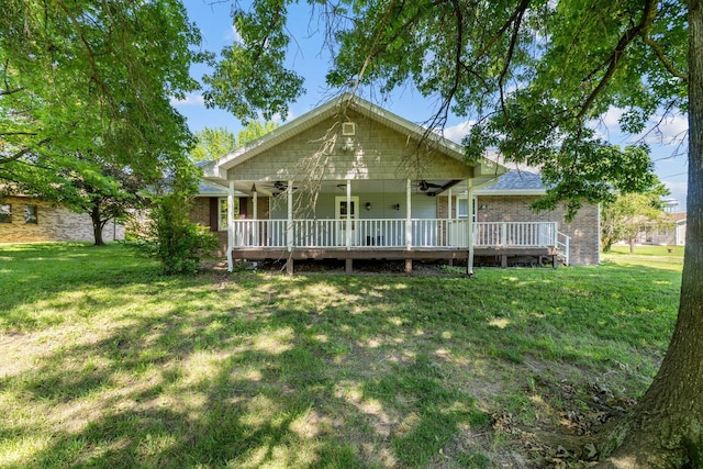 641 N Park Pl, Bolivar, MO 65613 - view of front of home featuring ceiling fan, a front lawn, brick siding, and a deck