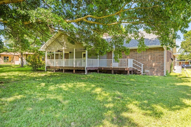 641 N Park Pl, Bolivar, MO 65613 - rear view of house with a yard, brick siding, roof with shingles, and ceiling fan
