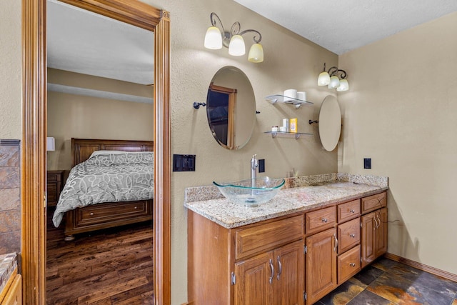 641 N Park Pl, Bolivar, MO 65613 - ensuite bathroom featuring vanity and baseboards