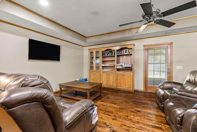 641 N Park Pl, Bolivar, MO 65613 - living area with ornamental molding, dark wood-type flooring, a ceiling fan, and a tray ceiling
