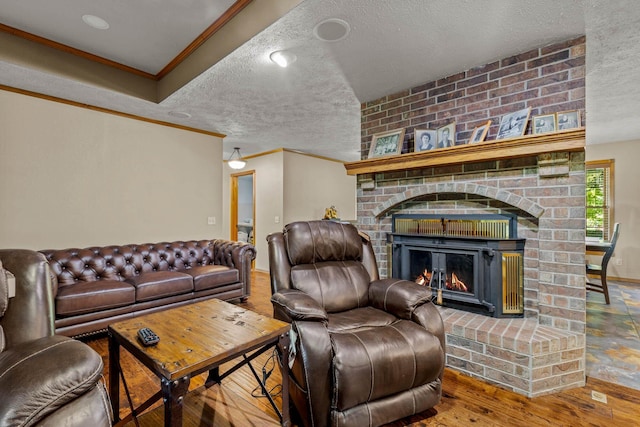 641 N Park Pl, Bolivar, MO 65613 - living room with crown molding, a textured ceiling, wood finished floors, and a brick fireplace