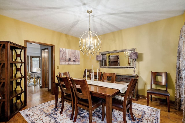 3449 S Woodstock Dr, Springfield, MO 65809 - dining space with a chandelier and wood finished floors