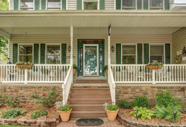 3449 S Woodstock Dr, Springfield, MO 65809 - entrance to property featuring covered porch and stone siding