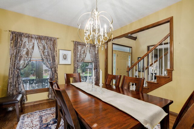 3449 S Woodstock Dr, Springfield, MO 65809 - dining room featuring a chandelier, plenty of natural light, wood finished floors, and stairway