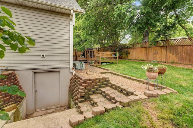 3449 S Woodstock Dr, Springfield, MO 65809 - fenced backyard with a deck