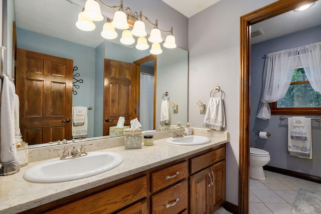 3449 S Woodstock Dr, Springfield, MO 65809 - bathroom featuring double vanity and tile patterned floors
