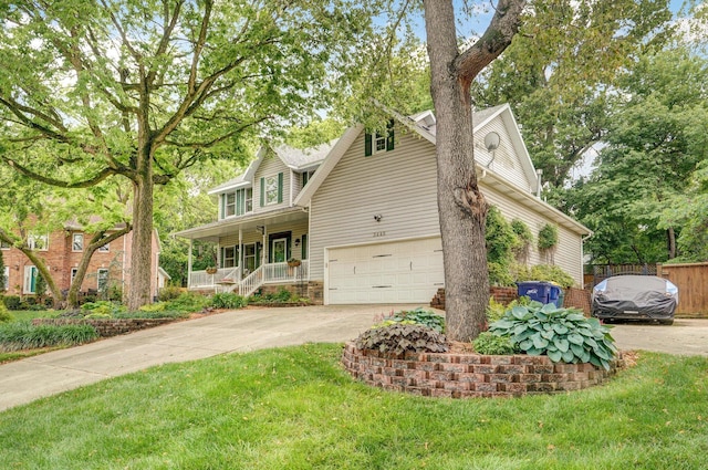 3449 S Woodstock Dr, Springfield, MO 65809 - view of front of home with covered porch, concrete driveway, and an attached garage