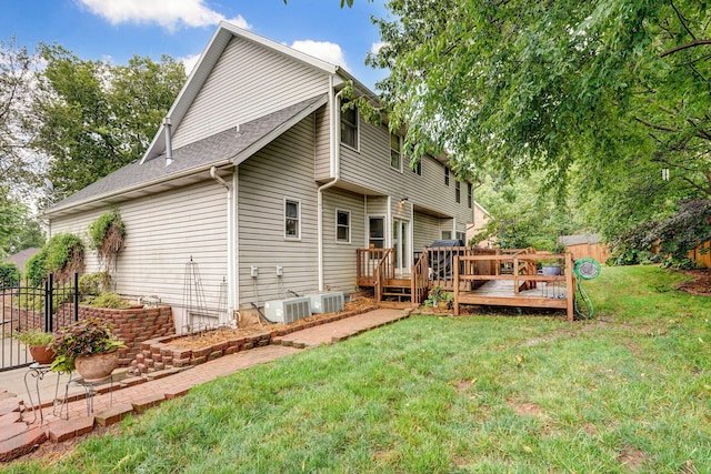 3449 S Woodstock Dr, Springfield, MO 65809 - rear view of property with a deck and roof with shingles