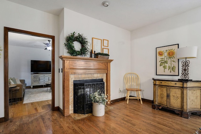 3449 S Woodstock Dr, Springfield, MO 65809 - living area featuring wood finished floors and a tiled fireplace