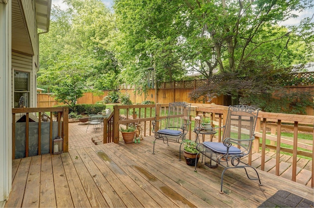 3449 S Woodstock Dr, Springfield, MO 65809 - deck with a fenced backyard