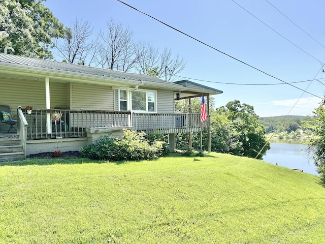 25419 County Road 327, Urbana, MO 65767 - view of front of home featuring a front lawn, a porch, and a metal roof