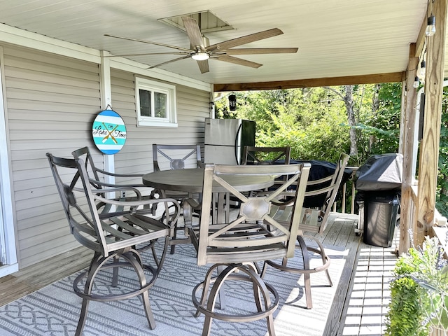 25419 County Road 327, Urbana, MO 65767 - deck with outdoor dining area, ceiling fan, and area for grilling