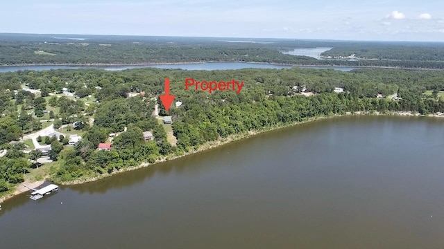 25419 County Road 327, Urbana, MO 65767 - aerial view of property and surrounding area with a heavily wooded area and a large body of water