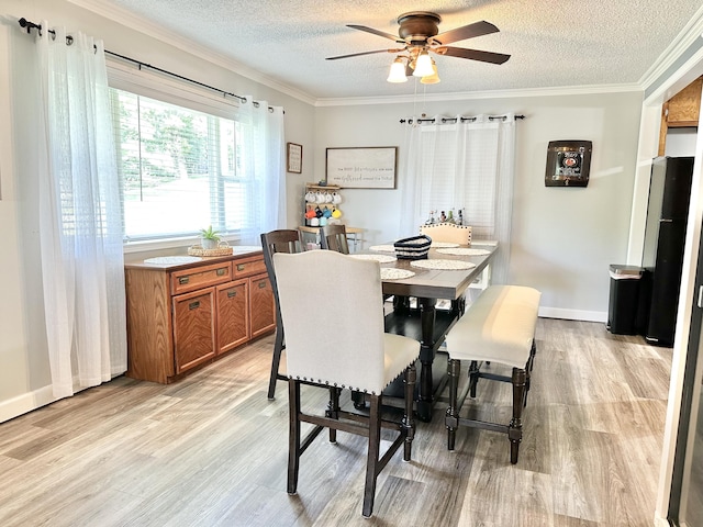 25419 County Road 327, Urbana, MO 65767 - dining space featuring a textured ceiling, light wood-style flooring, ceiling fan, and crown molding
