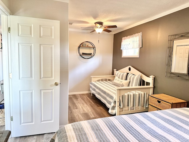 25419 County Road 327, Urbana, MO 65767 - bedroom with wood finished floors, a textured ceiling, and ceiling fan