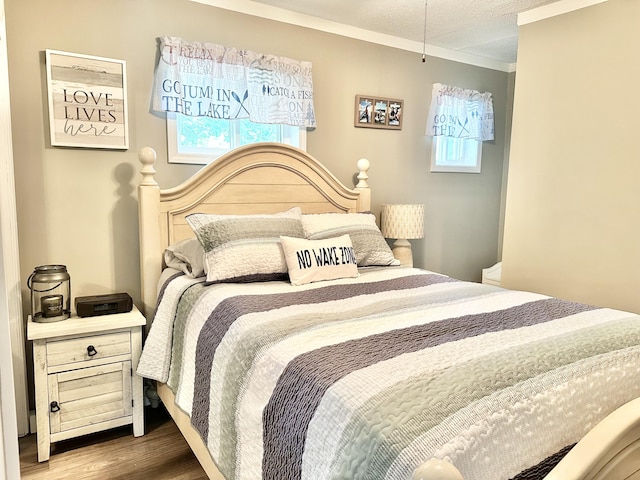 25419 County Road 327, Urbana, MO 65767 - bedroom with wood finished floors, multiple windows, and crown molding