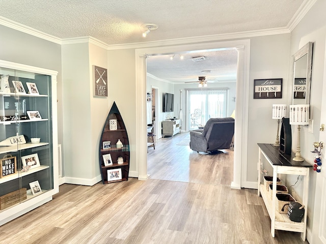25419 County Road 327, Urbana, MO 65767 - corridor featuring wood finished floors, a textured ceiling, and crown molding