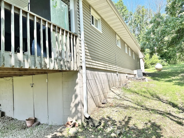 25419 County Road 327, Urbana, MO 65767 - view of side of home with a cooling unit and a yard