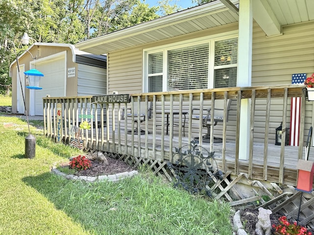 25419 County Road 327, Urbana, MO 65767 - view of home's exterior featuring a deck, a lawn, and an outdoor structure