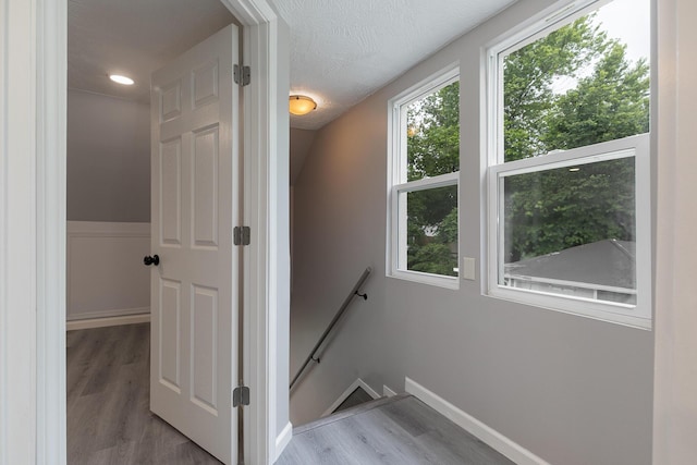 720 W Mount Vernon St, Springfield, MO 65806 - staircase featuring wood finished floors and baseboards