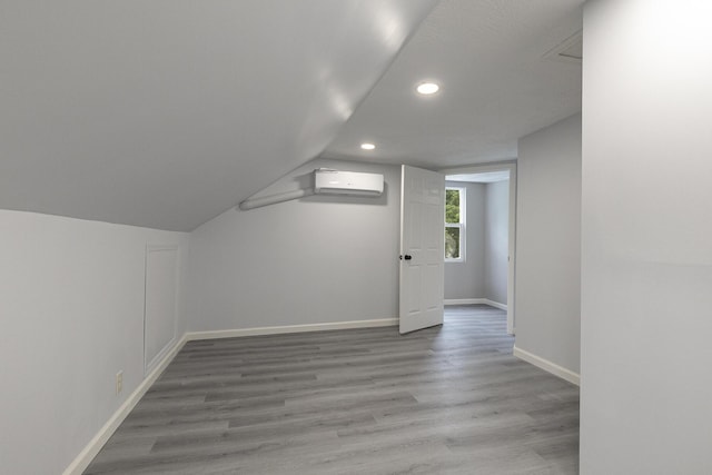 720 W Mount Vernon St, Springfield, MO 65806 - bonus room with a wall mounted air conditioner, recessed lighting, wood finished floors, and vaulted ceiling