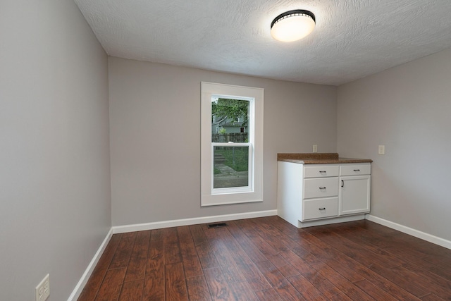 720 W Mount Vernon St, Springfield, MO 65806 - empty room featuring dark wood-style floors and baseboards