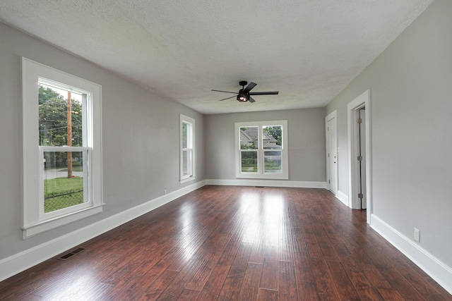 720 W Mount Vernon St, Springfield, MO 65806 - spare room with ceiling fan, dark wood-style floors, and a textured ceiling