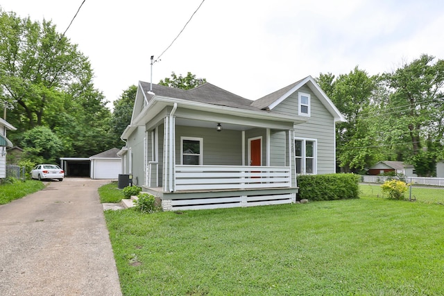 720 W Mount Vernon St, Springfield, MO 65806 - view of front of house with a porch, a detached garage, a shingled roof, and an outdoor structure